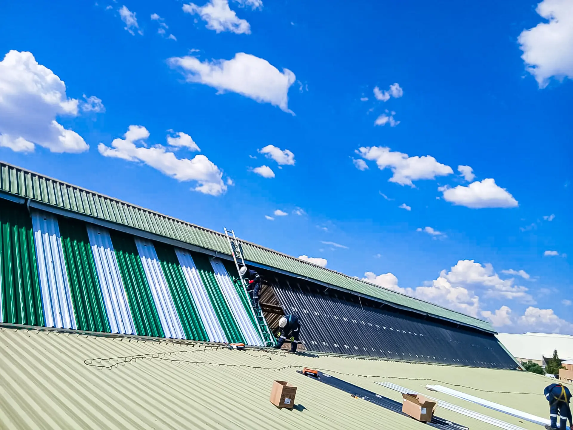 Experienced team completing a commercial corrugated metal roof replacement near you, ensuring quality and durability.